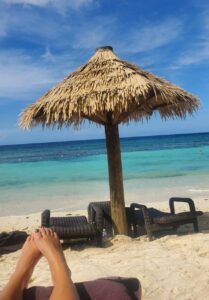 The beach, sand, and umbrella